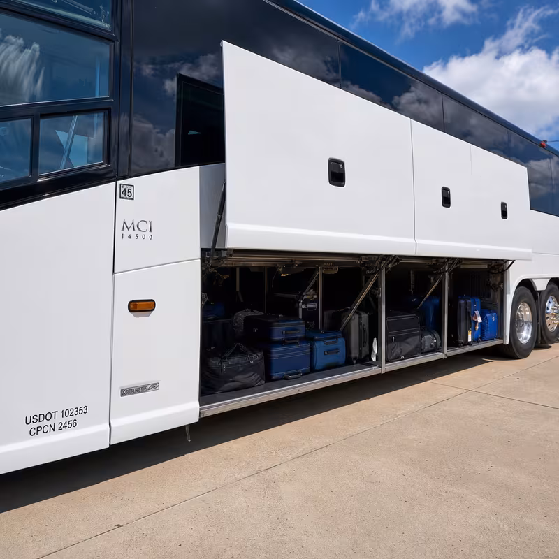 Party bus interior with wraparound leather seating and LED lighting in Indianapolis
