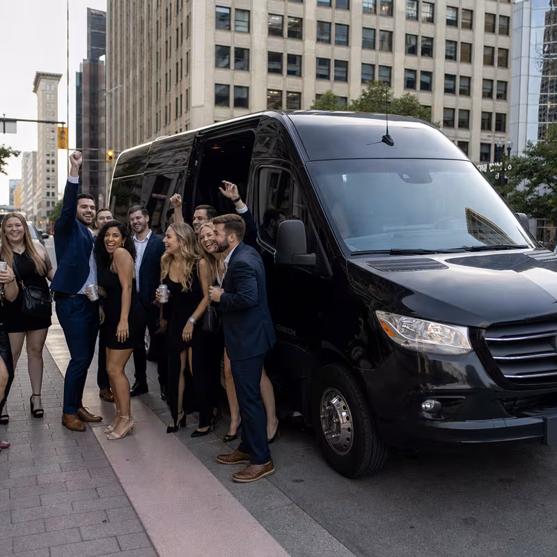Group boarding a white charter bus for Bachelor & Bachelorette Transportation transportation in Indianapolis