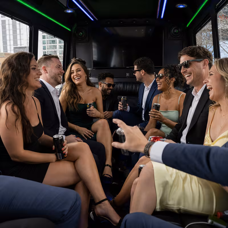 Party bus interior with wraparound leather seating and LED lighting in Indianapolis