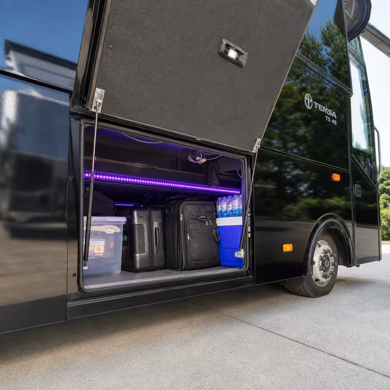 Party bus interior with wraparound leather seating and LED lighting in Indianapolis