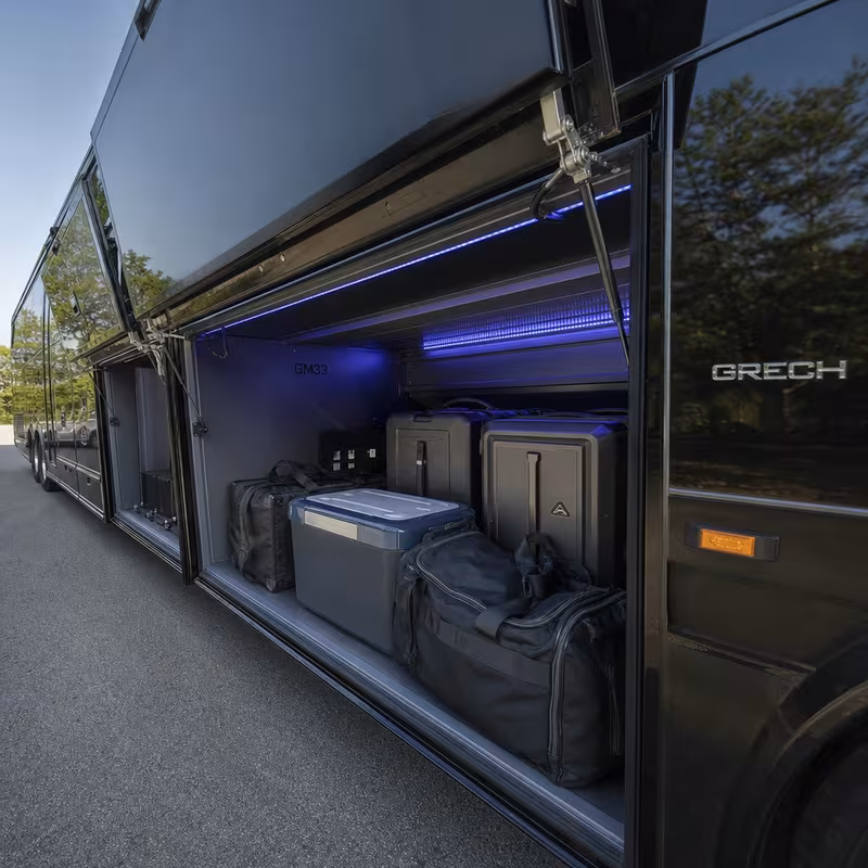 Party bus interior with wraparound leather seating and LED lighting in Indianapolis